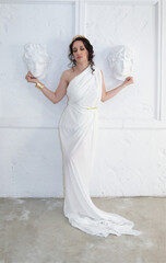 Beautiful Greek goddess woman close up on the white background.Greek style woman.
