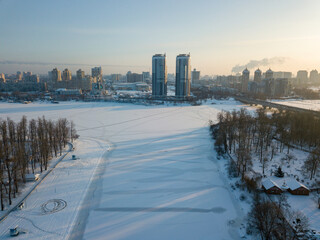 The frozen Dnieper river in Kiev. Aerial drone view. Winter sunny frosty morning.