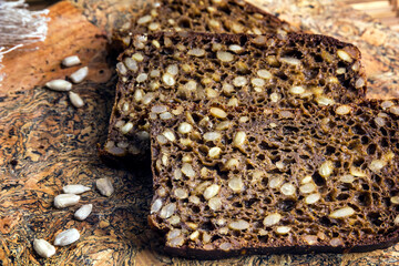 Sliced rye bread baked with sunflower seeds.
