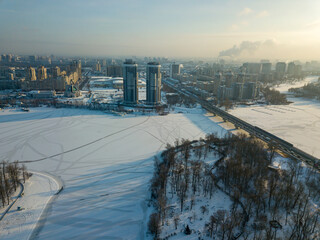 The frozen Dnieper river in Kiev. Aerial drone view. Winter sunny frosty morning.