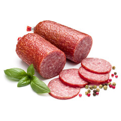 Salami smoked sausage, basil leaves and peppercorns isolated on white background cutout