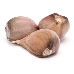Three garlic cloves isolated on white background cutout