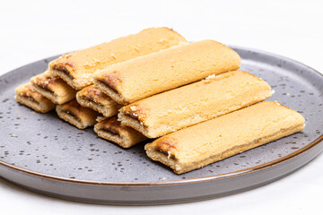 Cookies with fruit filling above white background