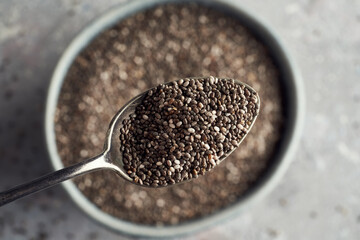 Chia seeds on a metal spoon