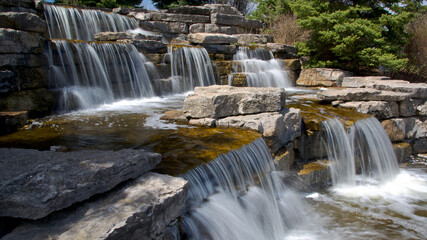 View of the waterfall in a public park. Beautiful, scenic, and very attractive for visitors.