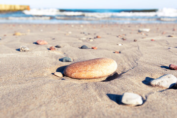 Stony coast of Baltic sea in Latvia, amazing sunset over sandy beach, nature, landscape