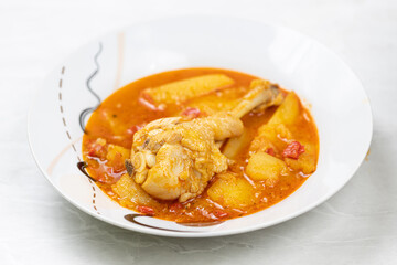 Cooked and served chicken stew in the plate