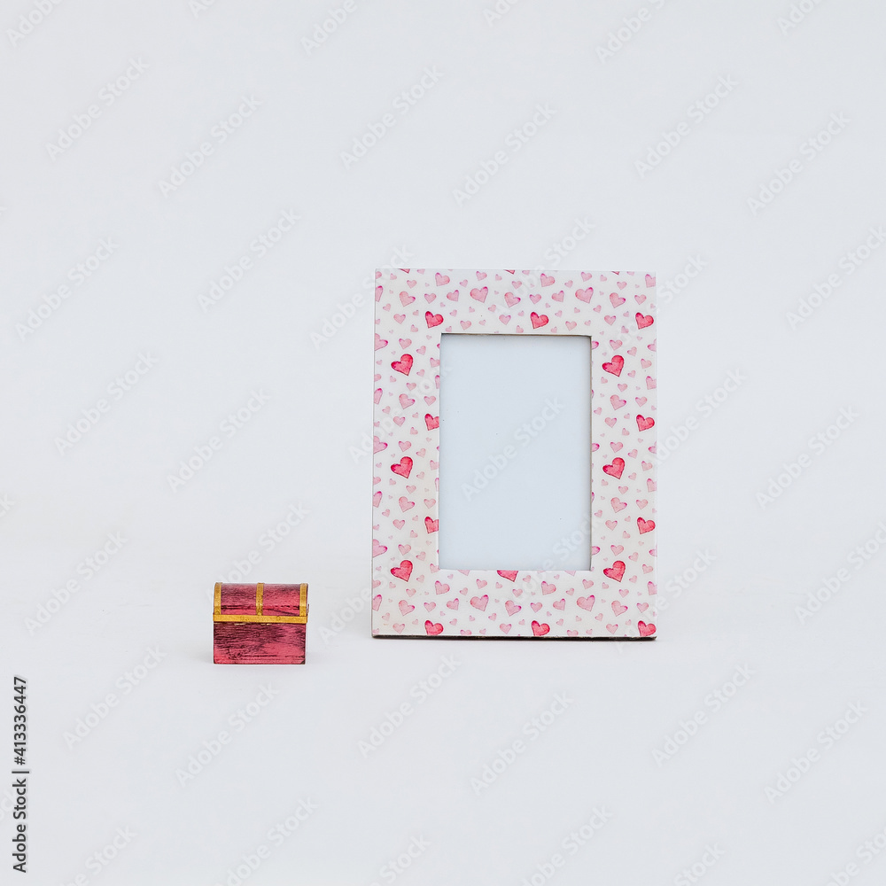 Aufkleber closeup view of a picture frame with tiny red and pink hearts on it placed on a white background