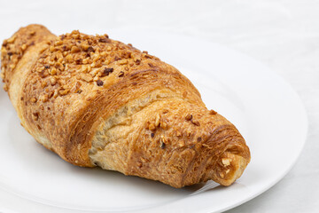 Croissant with chocolate on the plate