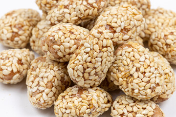 Fried peanuts with sesame above white background