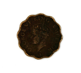Old coin of India one anna on white background isolated