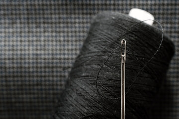 Needle and thread close-up. Macro. Items for the work of a tailor and seamstress. Crafts