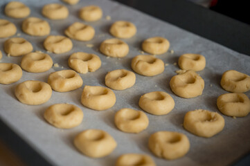 Detail of plate full of home made cookies ready to be baked.