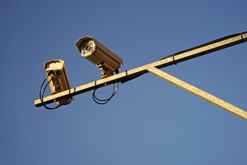 Closeup traffic security speed cameras above road, traffic camera concept