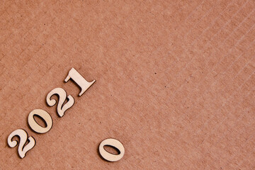 Number two thousand twenty first year is laid out on a cardboard background.