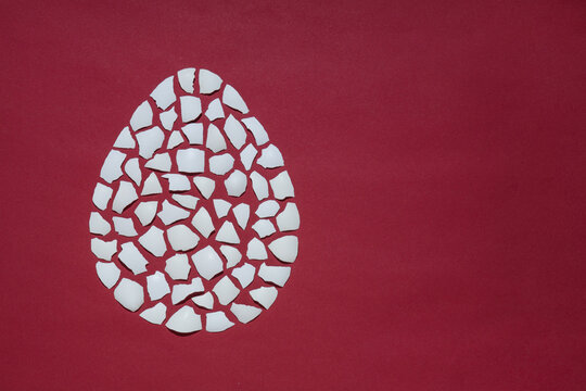 Eggshell In The Shape Of An Egg, Mosaic On A Red Background, Easter Pattern, Free Space, Mock Up For Design