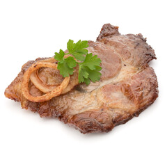 Cooked fried pork meat with parsley herb leaves and onion slices garnish isolated on white background cutout