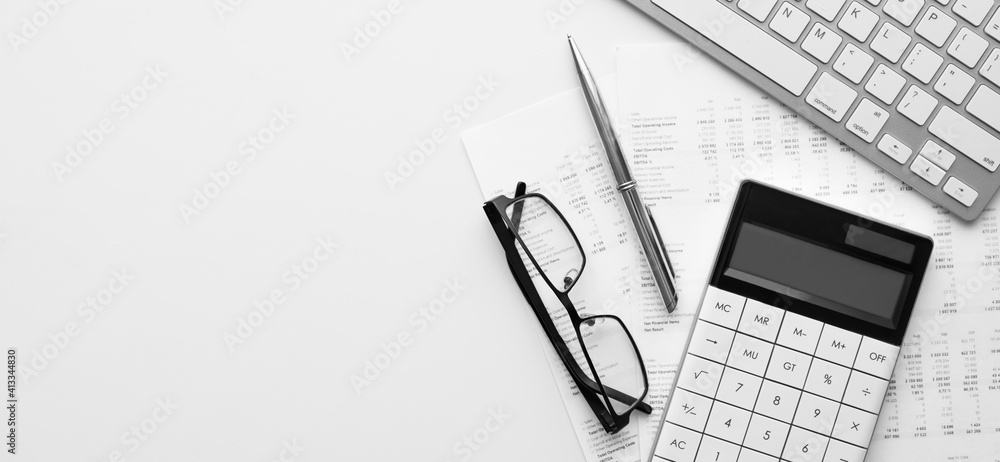 Poster calculator on financial statement and balance sheeet on desk of auditor. concept of accounting and a
