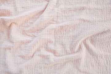 Muslin cloth texture background in neutral tones. Muslin cotton fabric of plain weave. Muslin is a soft, woven, 100-percent cotton multi-layer cloth popular for baby cloths and blankets - obrazy, fototapety, plakaty