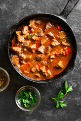 Stewed chicken livers in frying pan