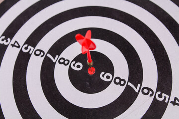 red dart darts in the center of the target hit the target won