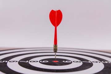 red dart darts in the center of the target hit the target won