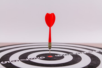 red dart darts in the center of the target hit the target won