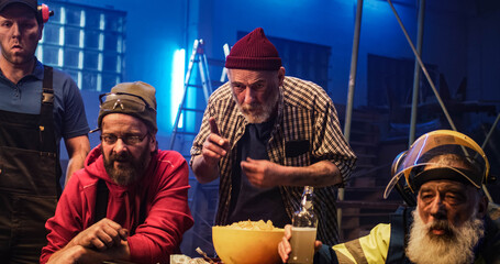 Male fans celebrating goal in garage