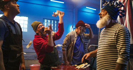 Man celebrating bet victory amidst friends