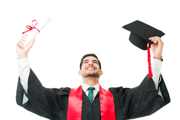 Male graduate holding up his cap and certificate as a celebration