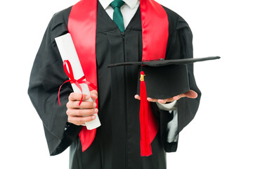 Close up of male hands showing his graduation cap and college certificate