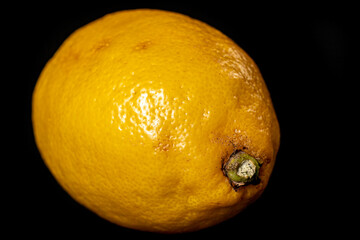 Fresh lemons on the black table. Citrus used to season dishes.