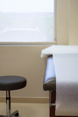 Patient examination table in a doctors office