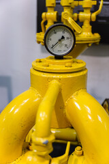 Circular pressure gauge on the compressor.