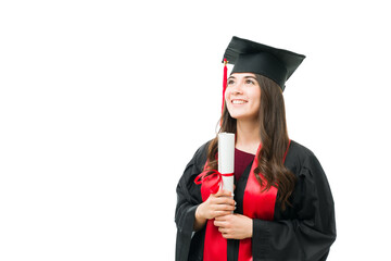 Pleased female graduate receiving her college degree