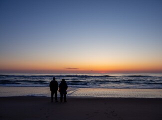 Old couple waiting for the sun rise