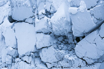frozen rocks in frost and snow