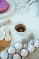 Young beautiful woman bakes a cake. Sweets. Confectionery.