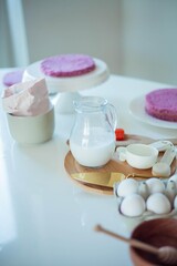 Young beautiful woman bakes a cake. Sweets. Confectionery.