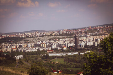 Warm landscape of a city from the hill view during summer time