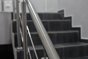 Stainless steel handrails of a new office premise, selective focus.