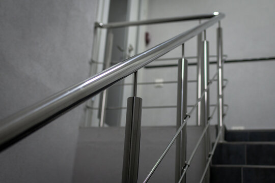 Stainless steel handrails of a new office premise, selective focus.