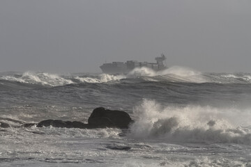 Fototapeta na wymiar Container ship on a stormy day