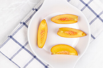 Top view of Peaches served on the plate.