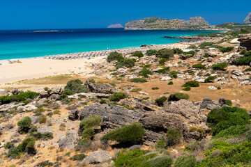 Fototapeta na wymiar Beautiful turquoise beach Falasarna (Falassarna) in Crete, Greece. View of famous paradise sandy deep turquoise beach of Falasarna (Phalasarna) in North West, Crete island, Greece.
