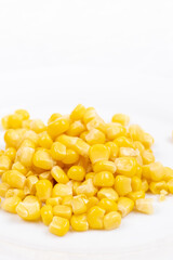 Cooked Sweet Corn above white background