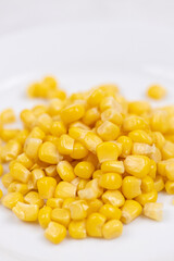 Cooked Sweet Corn above white background