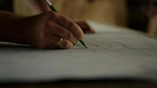 Unknown guy getting ready to produce wooden product indoors. Man hand designing 