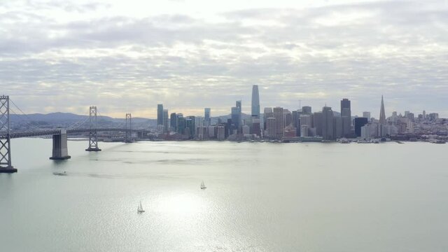 Aerial: city skyline cloudy, drone view