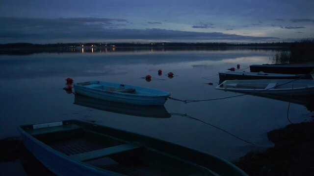 Some boats at a tiny pier at the schladitzer see near the town of leipzig